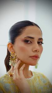 “Grace in every drop, power in every detail. The Eraya Earrings—where  delicate floral engravings meet bold pops of color. Gold-plated luxury,  light green elegance, and a touch of fiery pink—because ...