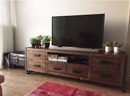 Looking For An Awesome And Inexpensive Diy Television Stand Look No More Take Your Pick From These Incredibly Great Televisio Tv Stand Designs Home Tv Stand