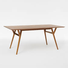 Whether you're having a nightly dinner with the family or inviting guests, this wood dining table. Mid Century Expandable Dining Table