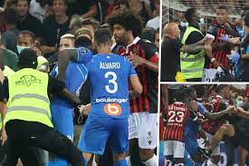 French ligue 1 match between marseille and ogc nice descended into chaos and was eventually suspended after fans threw a bottle that hit om attacker dimitri payet. Zec755lar0kbfm