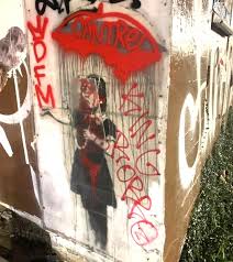 Banksy graffiti street art banksy banksy canvas graffiti piece bansky banksy artwork famous graffiti artists street artists pulp fiction. Second Banksy Vandalized 2008 Umbrella Girl Painting By The Graffiti Master Attacked Arts Nola Com