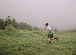 Man In Grey T Shirt And Black Shorts Running On Green Grass Field During Daytime Photo Free Apparel Image On Unsplash Photo Hd Photos Unsplash
