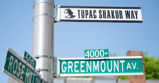 The late hip-hop legend Tupac Shakur, who lived in Baltimore, has street  dedicated to him - CBS Baltimore