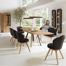 With a large rectangular table and eight chairs, this modern dining table set brings charming elegance to any space. Hartmann Runa Large Extending Oak Dining Table Seats 12 Harrogate