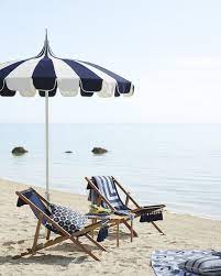 relax beach side in our tasseled sling chair made of weather resistant grade a teak our striped beach umbr beach chair umbrella beach chairs beach necessities