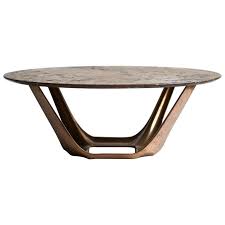 This round coffee table boasts a luxurious top of bright white marble. Barbera Heron Round Coffee Table Modern Solid Bronze Base With Stone Top For Sale At 1stdibs