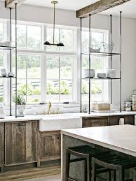 here s a bright storage idea extend your open shelving across the kitchen windows open shelving kitchen window open kitchen shelves
