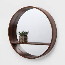 Its round frame is encased in a wooden frame that features a weathered gray finish for an antique, coastal appeal. Design Decor Mirror With Shelf Mirror Wall Living Room Wall Mirror With Shelf