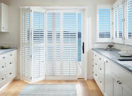 Shutters can be painted to match kitchen cabinetry for continuity. Interior Vinyl Shutters Innuwindow
