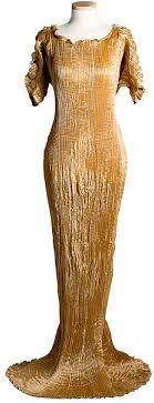 Vibrant blue silk trimmed at the shoulder, armhole and side with black and white striped murano glass beads, silver stenciled blue silk twisted and looped sash with. Mariano Fortuny Y Madraza Designmatters