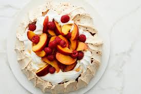 Pile high with lemon curd, whipped cream, and fresh fruit to make a naturally delicious gluten free that's three completely different textures in one single bite. Raspberry Pavlova With Peaches And Cream Recipe Nyt Cooking