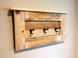 An extraordinary coat hanger that comes with a dispersed structure built from a barrel shaped base and a bundle of scattered wood sticks, of which the tips work as hanging pegs. Get Hooked On These Great Diy Coat Rack Ideas
