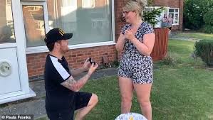 Man surprises NHS girlfriend and proposes during Clap For Carers