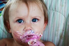 The birthday girl enjoying her cake.