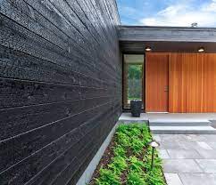 The carbonised wood brushes off, and. The Beauty Of Nakamoto Forestry Charred Wood Siding