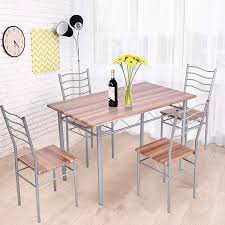 Breathe new life into your dining room with these simple decorating ideas. Tangkula 5 Piece Dining Table Set Modern Simple Design Wood Top And Metal Frame Dining Table And Chairs Dining Room Kitchen Furniture Set Dining Room Table Set Buy Online In Antigua And