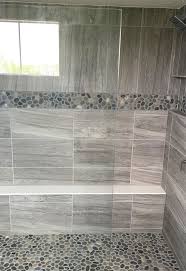 Gray Stone Look Large Format Wall Tile With Pebble Mosaic Accent And Shower Floor Master Shower Inspira Stone Shower Floor Stone Shower Stone Tile Bathroom