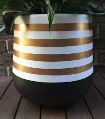 Black And White Striped Flower Pots Hand Painted Lightweight Plant Pot In Black And White With Rose Gold Metallic Stripes This Is A Strikin Painted Flower Pots Indoor Plant Pots Painted Pots Diy