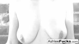 Busty Ashlee Graham smokes while showing off her natural tits