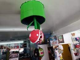Things To Do In La World 8 What A Video Game Store Should Be Love The Idea Of Stuff Hanging From Ceiling Video Game Stores Game Store Video Game Room Design