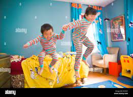 Page 3 Girl Boy Jumping Bed High Resolution Stock Photography And Images Alamy