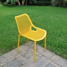 Allmodern Curnutt Stacking Patio Dining Armchair Wayfair In 2020 Outdoor Dining Chairs Patio Dining Chairs Yellow Outdoor Furniture