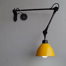 Another smart black swing arm wall lamp that fits perfectly with just about any contemporary decor. Shop Yellow Wall Lamp Industrial Swing Arm Wall Mounted Light Online Wall Mounted Light Industrial Wall Lamp Wall Sconces