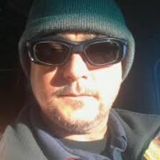 What model is the car spotted at the mechanic salvage yard?