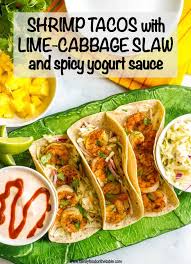 This simple recipe features blackened fish with homemade seasoning and topped with cabbage slaw and a creamy chipotle sauce. Shrimp Tacos With Lime Cabbage Slaw And Spicy Yogurt Sauce Family Food On The Table
