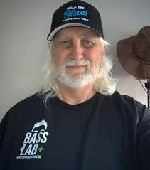 Greg with the Bass for his store sign before he put it up.