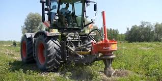 Disposing of old tree stumps. Rotor Stump Grinder Digs Up Tree Stumps