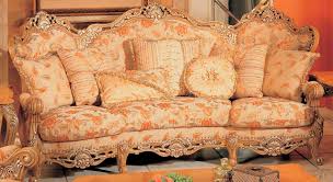 Featuring a solid wood frame in antique pearl and gold brushed finish, this collection is guaranteed to be the highlight of any home. Traditional Peach Floral Print Sofa With Ornate Wood Carved Accents