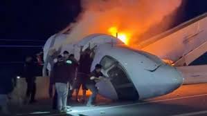 Rescuers rush to save people from crashed jet on Texas highway – video