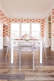 Acrylic is a trendy material for either upping the edge of a contemporary dining room or lending a playful juxtaposition in a more traditional space. Clear Acrylic Dining Chairs At White Bamboo Table Transitional Dining Room
