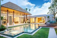 I look forward to welcoming you to our side of paradise. Home Or House Exterior Design Showing Tropical Pool Villa With Greenery Garden Sun Bed Umbrella Pool Towels Stock Photo 143671981 Megapixl