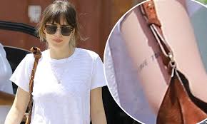 Woo, it was inspired by egon schiele, the austrian painter. Dakota Johnson Shows Off I Love You Arm Tattoo Daily Mail Online