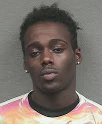 Twins charged in rape of teen at strip mall