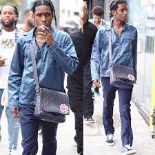 Asap rocky wearing maison margiela denim jacket with faux fur collar and lining, maison margiela distressed slim fit jeans, alexander wang kent high chukka boot, goyard 3d pattern belt Asap Rocky Seen Rocking Our Legacy Jacket Vans Sneakers And A Goyard Bag In La Vibzn Goyard Bag Vans Sneakers Goyard