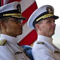 U.S. Navy Capt. Darren Hanson (left) is relieved by