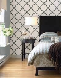 A bedroom feature wall can help to completely transform a space by creating a focal point. Black And White Decor Idea Bedroom Feature Wall With A Moroccan Print Wallpaper Feature Wall Bedroom Wallpaper Bedroom Feature Wall Home Decor