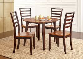 Four matching keyhole spindle back chairs. Abaco Brown Round Dining Set W 4 Chairs Furniture Market Gp