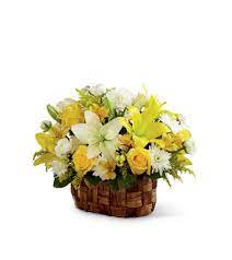 A whitewash handled basket is arranged with cream roses, white lilies, spray roses and more with added blue flowers. The Ftd Nature S Bounty Basket Richmond Hill On Florist