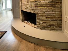 You just can't go wrong with plow & hearth. This Fireplace Features 3cm Fossil Gray Quartz Stonetex Llc Custom Granite Countertops