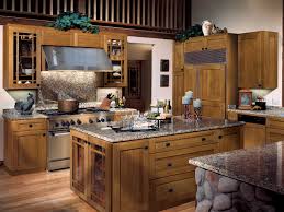 Kitchen features light brown oak coffee cabinets with seeded glass chevron pattern doors, white shaker cabinets, and a brown and white striped rug. Quarter Sawn Oak Kitchen Cabinets Dewils Custom Cabinetry