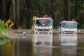 A flash flood warning (same code: Heavy Rain Flash Flooding Batter Australia S East Coast World News Us News