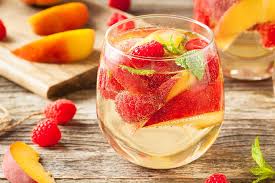 This refreshing fruity red sangria is the prefect cold drink to enjoy on a hot summer day when fresh fruit is at it's peak. Best Sangria Recipes Sparkling Peach Raspberry White Wine Sangria Recipe Cocktails 30seconds Food