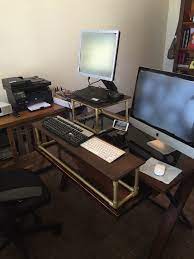 Diy Standing Desk Conversion Made Out Of Pvc And Wood For Under 40 Diy Standing Desk Standing Desk Conversion Off Grid Tiny House