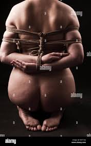 Young submissive woman in japanese bondage takate kote  BDSM theme Stock  Photo - Alamy