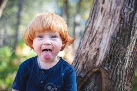 Baby, baby, that's for sure. Red Haired Boy With Long Hair And Tongue Hanging Out Stock Photo Picture And Royalty Free Image Image 125845066