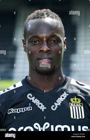 In this July 3, 2018 photo, Mamadou Aliou Barry, left, departed from his  native Guinea in West Africa when he was 14, a few years ago, waits for  entry to the U.S.